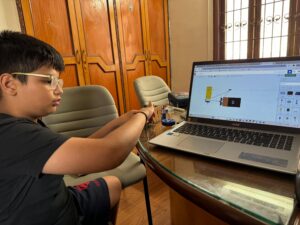 Kid doing 3D design on laptop
